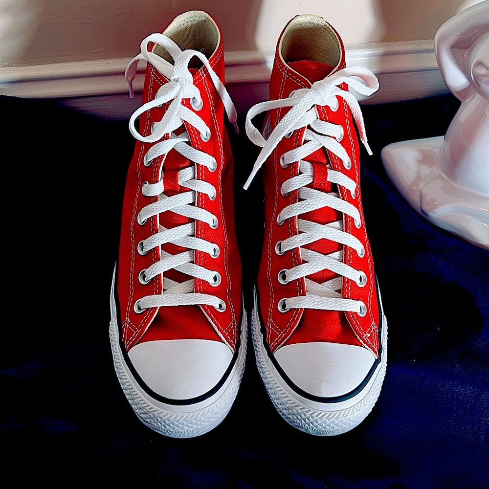 High to red converse sneakers.